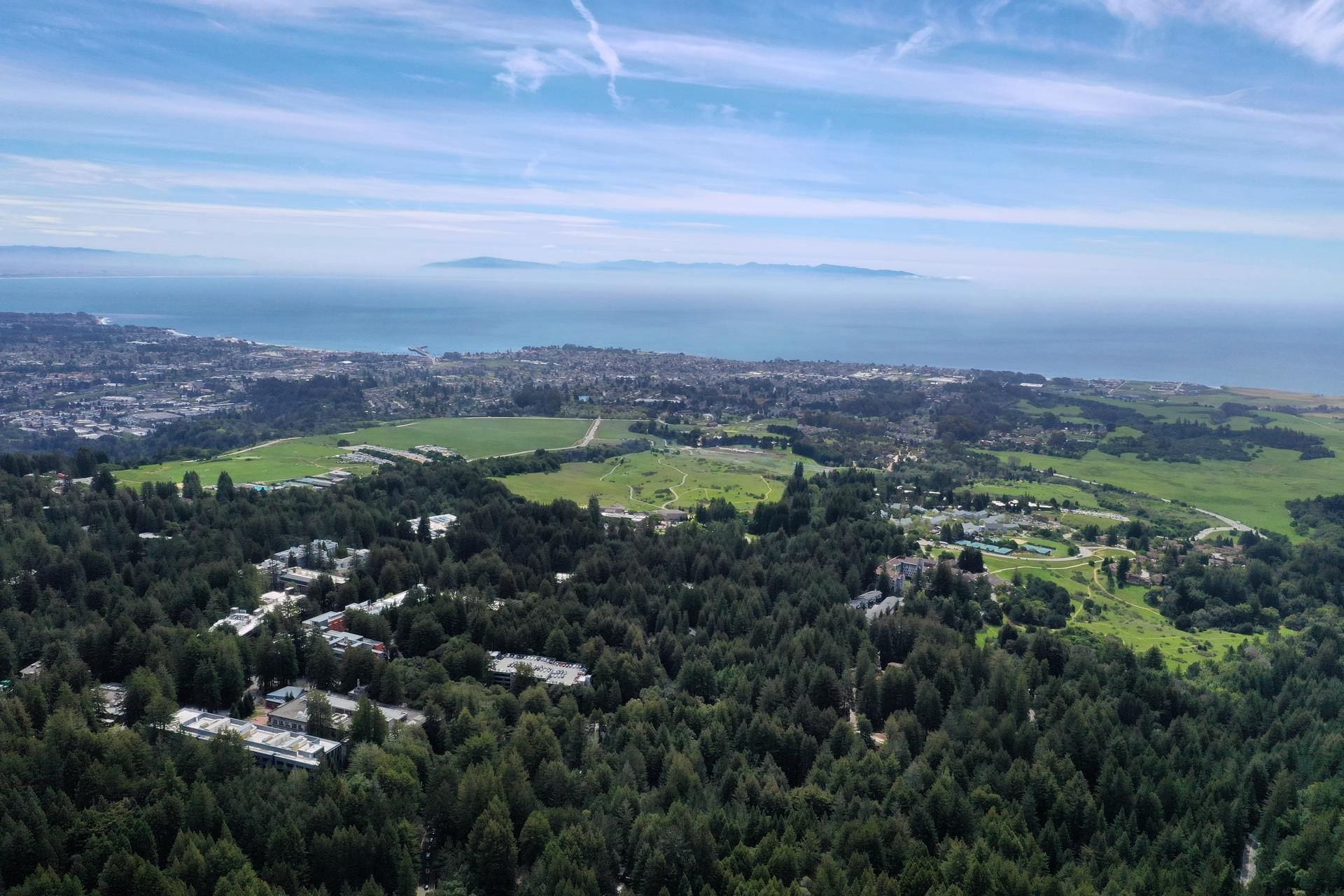 Aerial photo of campus, Monterey Bay and Santa Cruz.